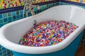 Bathtub filled with colorful beads