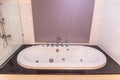 White bathtub with warm lighting against Royalty Free Stock Photo