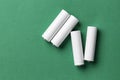 White batteries on a green background Royalty Free Stock Photo