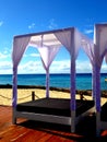White beach bed luxury looking at the carribian sea in dominican republic Royalty Free Stock Photo