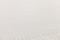 White beach sand with ripples and waves texture pattern Royalty Free Stock Photo