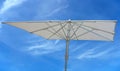 White beach umbrella concept over blue sky Royalty Free Stock Photo
