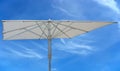 White beach umbrella concept over blue sky Royalty Free Stock Photo