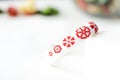 White beaded bracelet with red flower print Royalty Free Stock Photo