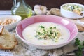 White bean cream soup with fried pearl barley and parsley, bread and olive oil Royalty Free Stock Photo