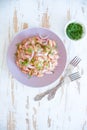 White bean, tuna and onion salad on a purple plate Royalty Free Stock Photo