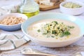 White bean vegetarian cream soup with fried pearl barley and parsley, bread and olive oil Royalty Free Stock Photo