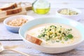 White bean vegetarian cream soup with fried pearl barley and parsley, bread and olive oil Royalty Free Stock Photo