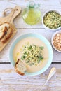 White bean vegetarian cream soup with fried pearl barley and parsley, bread and olive oil Royalty Free Stock Photo