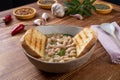 white beans soup with bread on kitchen table background Royalty Free Stock Photo