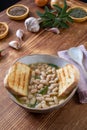 white beans soup with bread on kitchen table background Royalty Free Stock Photo