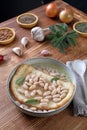 white beans soup with bread on kitchen table background Royalty Free Stock Photo