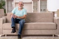 The white bearded old man suffering at home Royalty Free Stock Photo