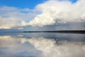 Clouds white on blue sky with reflection in lake during the day in the natural environtent.