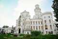 White beautiful state Chateau of Hluboka, neo-Gothic castle and gardens on a sunny summer day, famous national cultural landmark,