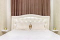 White bed in the white bedroom brown curtain. Light style Royalty Free Stock Photo