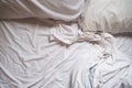 White Bed maid-up with wrinkled bed sheets after sexual night