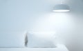 White bed sheets and pillows. Comfortable soft pillows on the bed. Close-up white bedding sheets and pillow on light wall room bac Royalty Free Stock Photo