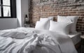 White bed sheets and pillows and white wall Royalty Free Stock Photo