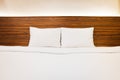 White bedding and pillow in hotel room, Clean Bedding sheets and pillow on natural wall