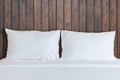 White bedding sheets and pillow in hotel room Royalty Free Stock Photo