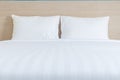 White bedding sheets and pillow in hotel room Royalty Free Stock Photo