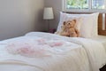 White bedroom decorative with pillows and dolls