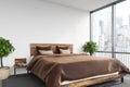 White bedroom, brown bed