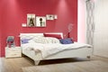 White bedroom with red wall Royalty Free Stock Photo