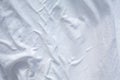 White bedsheet drying in the sun, Wrinkled texture, Abstract background, Close up shot, Select focus, Housework, Laundry
