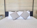 White bedsheet prepare on bed room. with pillow. clean interior comfort service room in spa and hotel Royalty Free Stock Photo