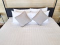 White bedsheet prepare on bed room. with pillow. clean interior comfort service room in spa and hotel Royalty Free Stock Photo