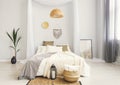 White and beige bedroom in boho style with macrame Royalty Free Stock Photo