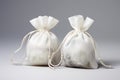 White and beige silk fabric bags with laces for storing jewelry