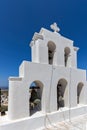 White bell tower in Pyrgos Kallistis, Santorini island, Thira, Greece