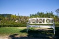 White bench at a garden during a sunny day, Royalty Free Stock Photo