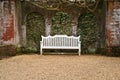 White bench on gravel path