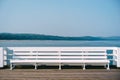 White bench on the pier