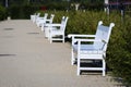 White benches in park