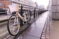 White bicycle on the street. Dawn in a modern city Royalty Free Stock Photo