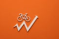 White bicycle with upward arrow on orange background - Concept of increasing bicycle prices