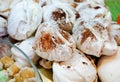 White big meringue with cocoa powder sold at local sweets store.