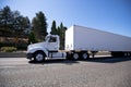 White big rig day cab semi truck and dry van trailer for local d Royalty Free Stock Photo