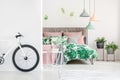 White bike in floral bedroom Royalty Free Stock Photo