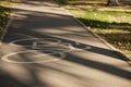 White bike path sign in the park