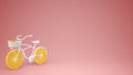 White bike with sliced orange wheels, healthy lifestyle concept with pink pastel background copy space Royalty Free Stock Photo