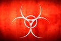 White biohazard sign over red background