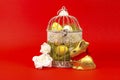 White bird cage with Easter eggs in it on a red background Royalty Free Stock Photo
