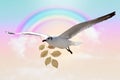 White Bird carrying a dry leaf branch is flying freely in the rainbow on sky abstract with a pastel colored background. Royalty Free Stock Photo