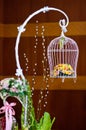 White Birdcage with flowers inside